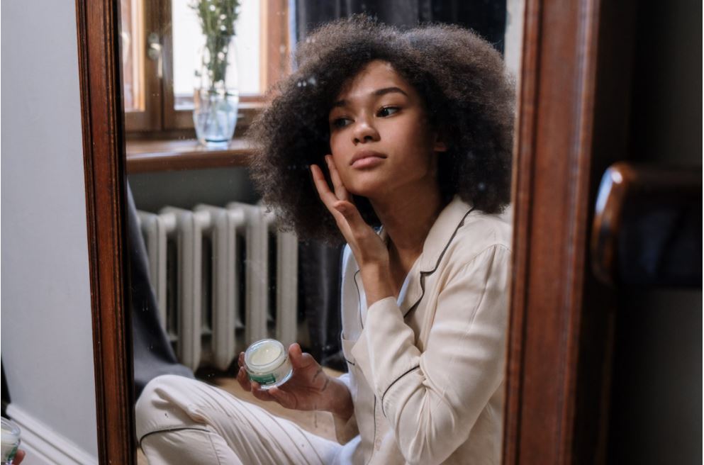 woman applying skin cream