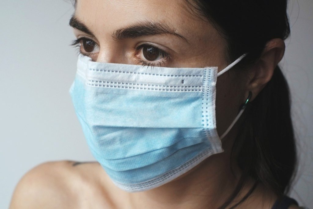 woman wearing a facemask: source - pexels